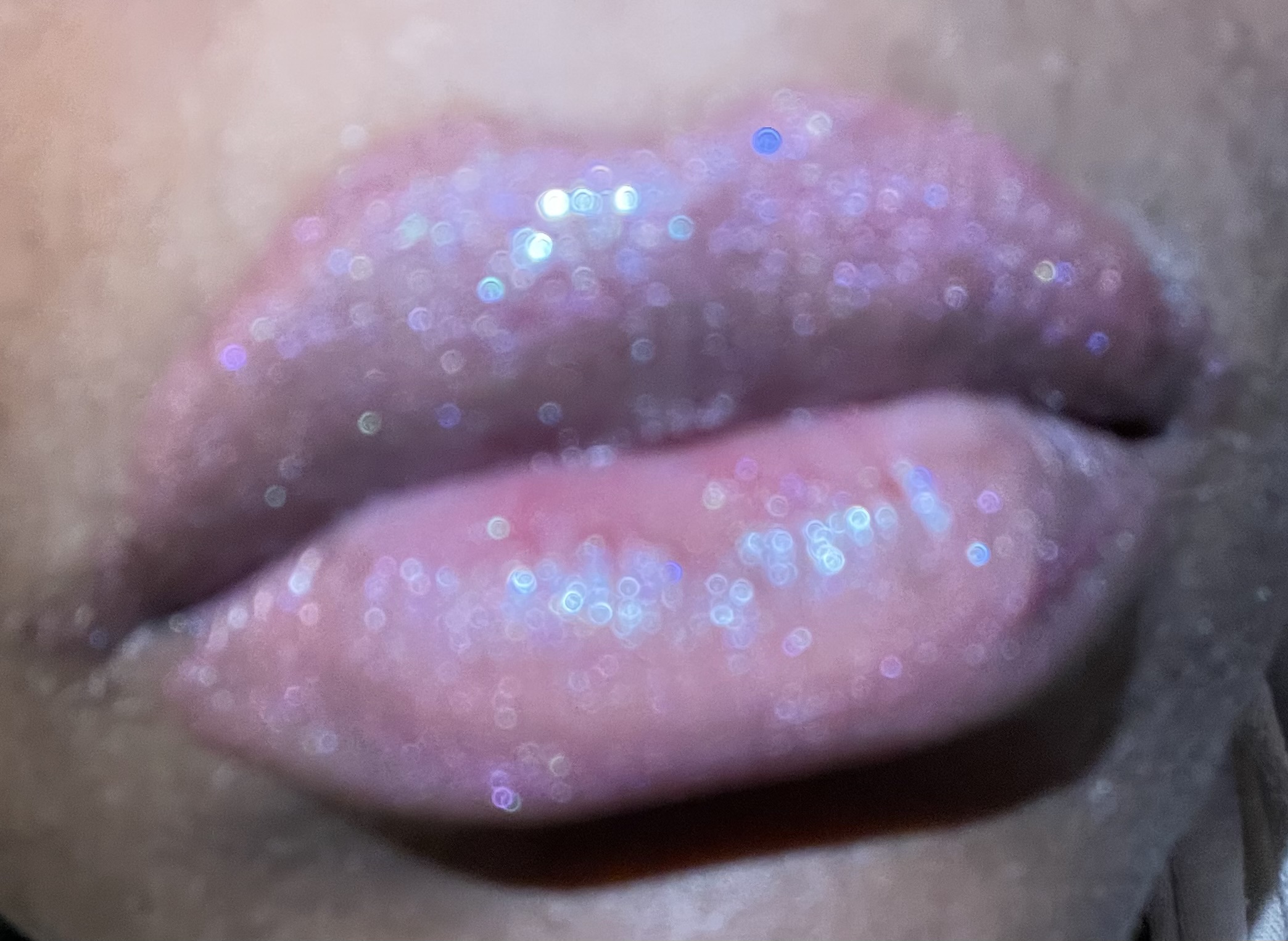 Close-up of founder lips wearing &ldquo;Pink Dream&rdquo; lip gloss, showcasing a smooth, glossy finish with a soft pink tint styled against a clean background to highlight shine, hydration and the self care of Scented Luminescence